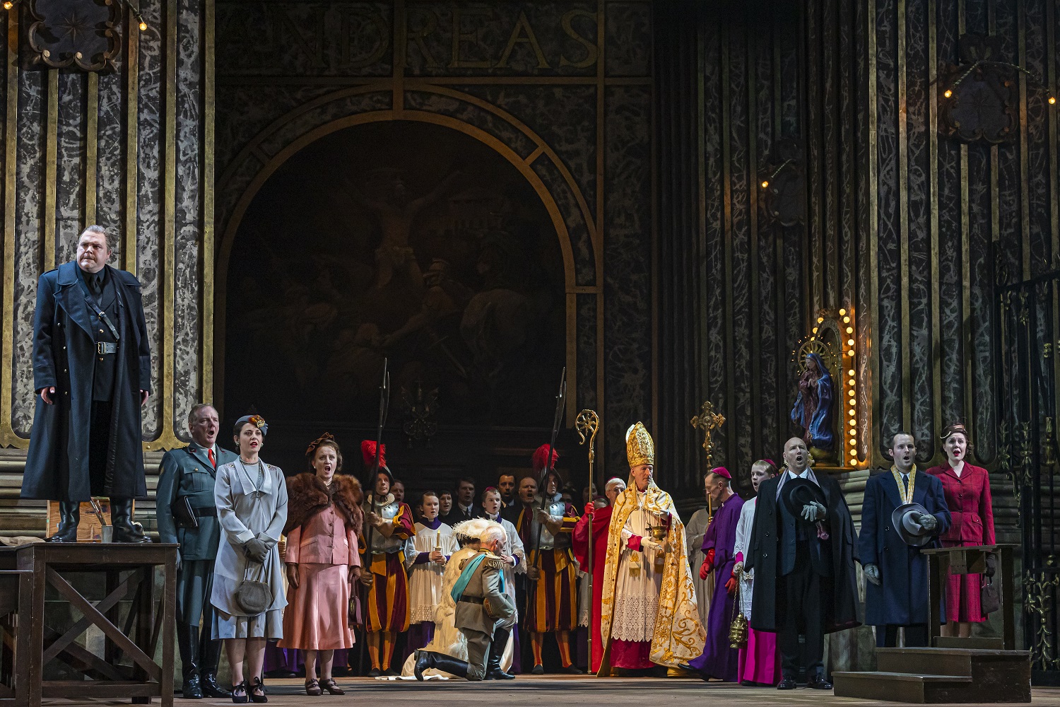 Roland Wood as Scarpia and the cast of Tosca. Scottish Opera 2019. Credit James Glossop