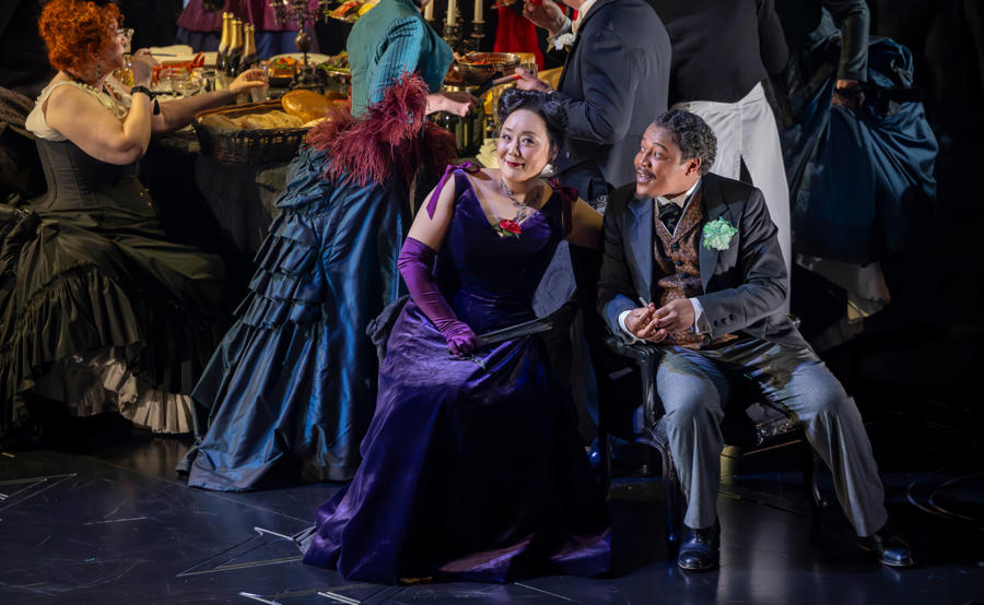 Hye Youn Lee (Violetta Valéry) and Monwabisi Lindi (Gastone) in La traviata. Scottish Opera 2024. Credit James Glossop.