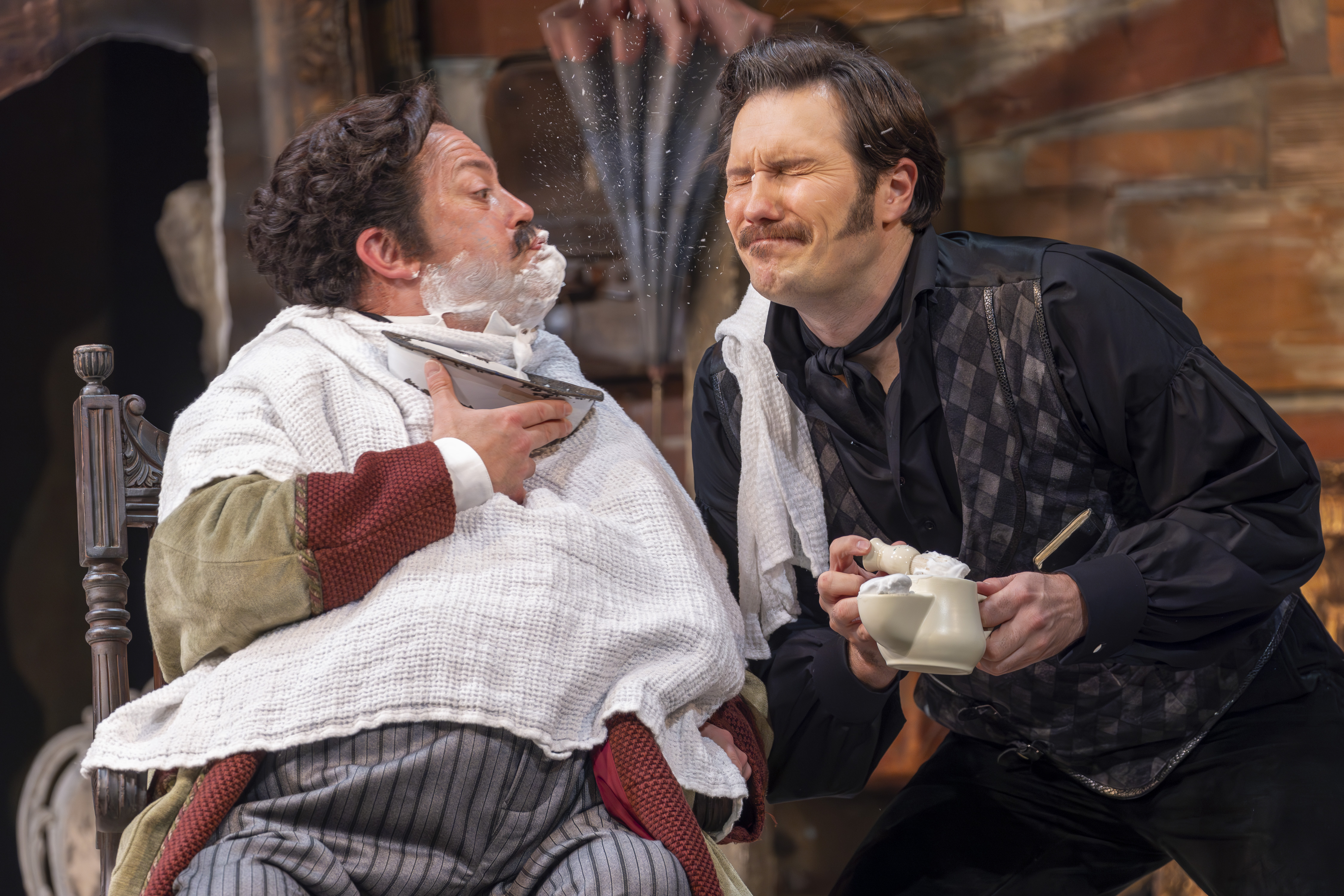 David Stout (Doctor Bartolo) and Samuel Dale Johnson (Figaro) in The Barber of Seville. Scottish Opera 2023. Credit James Glossop.