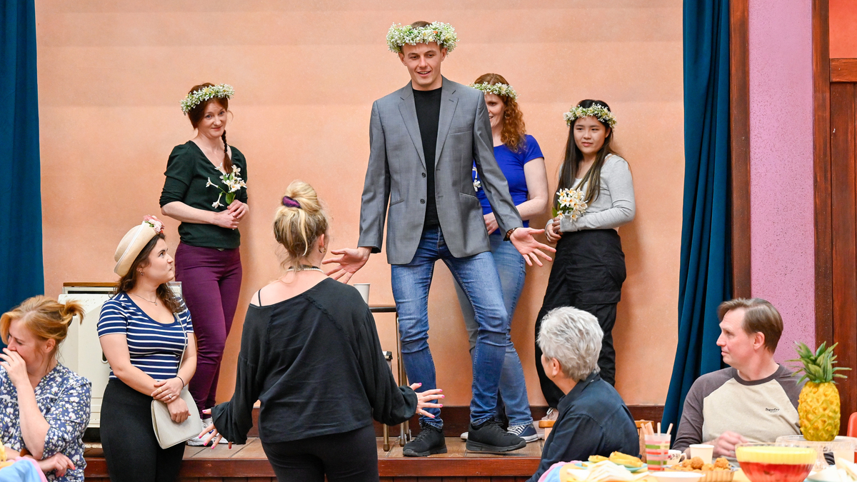 Director Daisy Evans with Glen Cunningham (Albert Herring) and the cast of Albert Herring in rehearsals. Scottish Opera 2024. Credit Julie Howden..