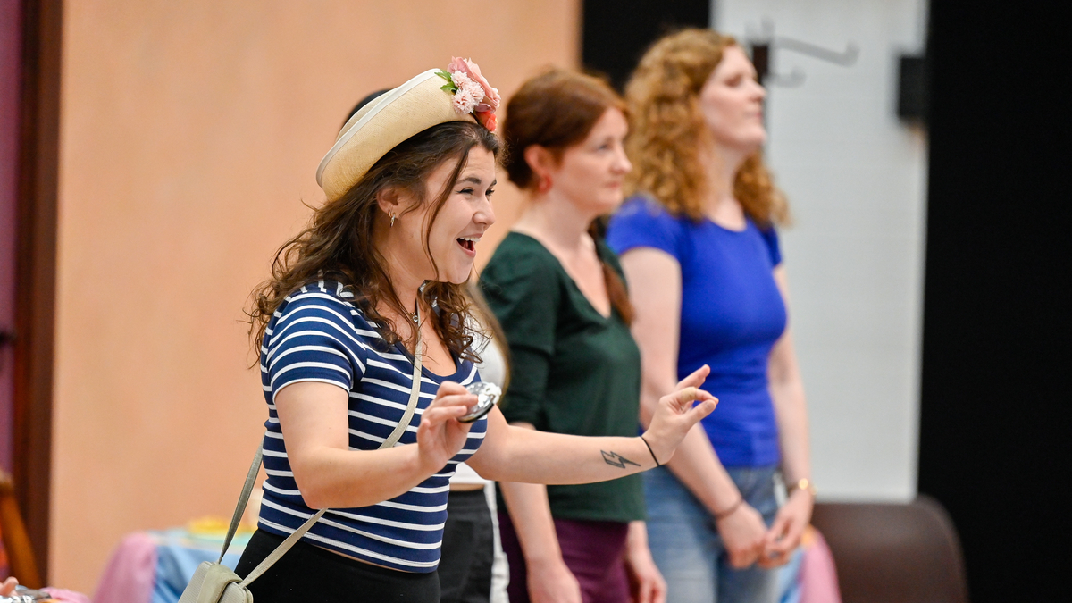 (L To R) Kira Kaplan (Miss Wordsworth), Cliona Cassidy (Harry) and Sarah Power (Emmie) in rehearsals for Albert Herring. Scottish Opera 2024. Credit Julie Howden..