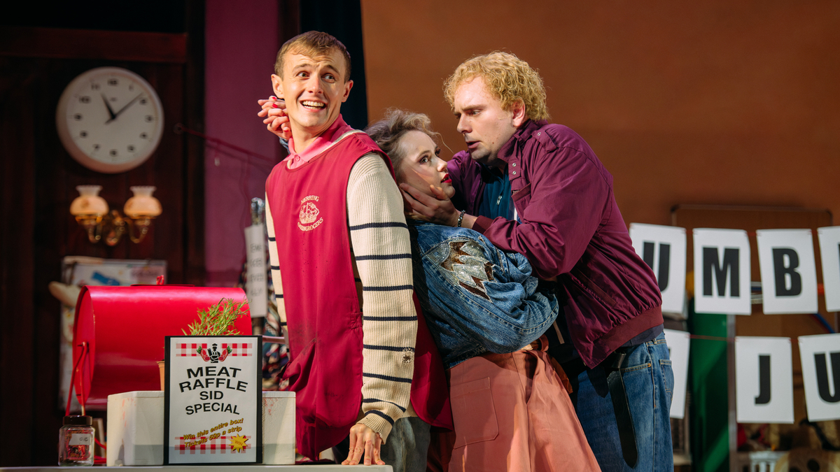 Glen Cunningham (Albert Herring), Chloe Harris (Nancy) and Ross Cumming (Sid) in Albert Herring. Scottish Opera 2024. Credit Mihaela Bodlovic..